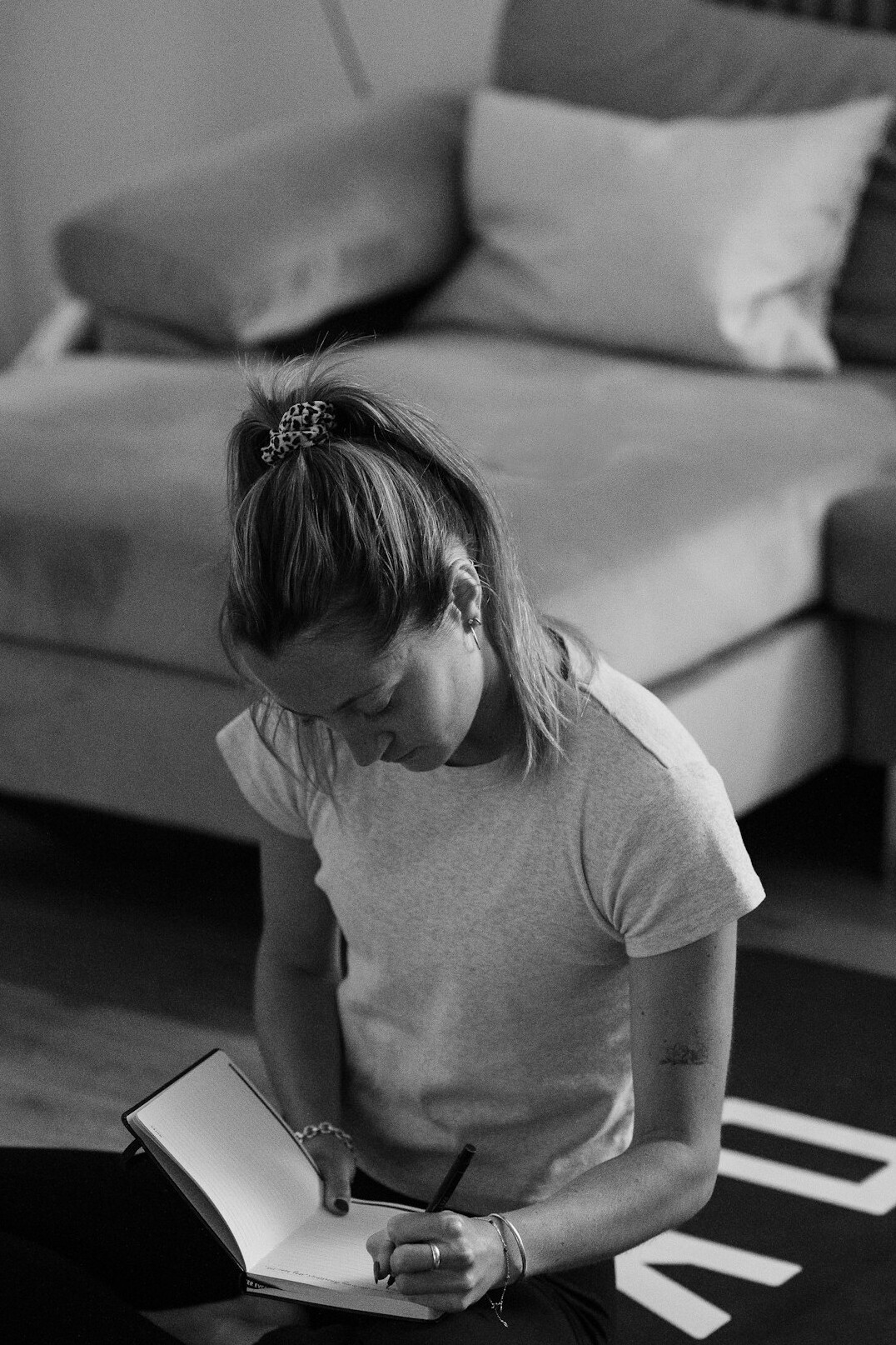 person writing in notebook